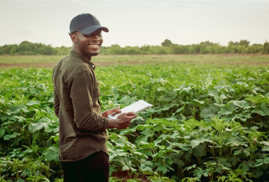 A man smiling on a Nana's Ricefarm