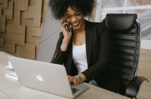 Side-Hustle to Business Woman behind a desk